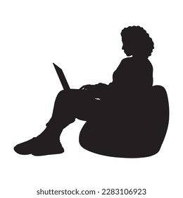  Curly hair woman with laptop sitting on bean bag silhouette.