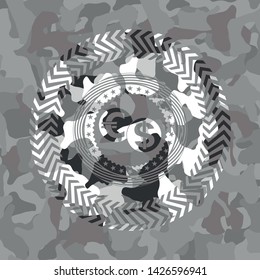 currency exchange icon inside grey camouflage emblem