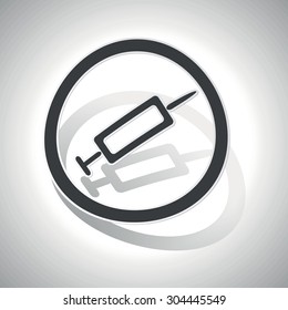 Curved circle with image of syringe and shadow, on white