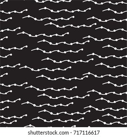 curved lines with dots, small circles, waves on a black background. Freehand drawing vector. modern seamless pattern.
