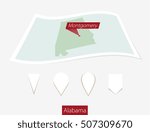 Curved paper map of Alabama state with capital Montgomery on Gray Background. Four different Map pin set. Vector Illustration.