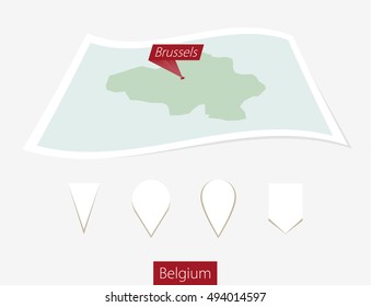 Curved paper map of Belgium with capital Brussels on Gray Background. Four different Map pin set. Vector Illustration.