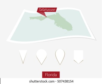 Curved paper map of Florida state with capital Tallahassee on Gray Background. Four different Map pin set. Vector Illustration.