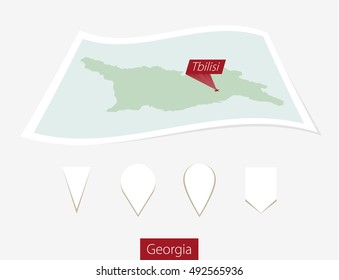 Curved paper map of Georgia with capital Tbilisi on Gray Background. Four different Map pin set. Vector Illustration.