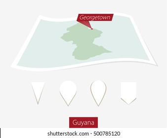 Curved paper map of Guyana with capital Georgetown on Gray Background. Four different Map pin set. Vector Illustration.