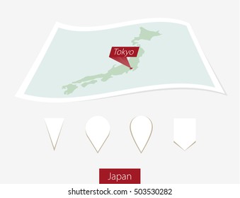 Curved paper map of Japan with capital Tokyo on Gray Background. Four different Map pin set. Vector Illustration.