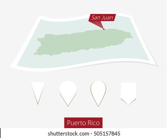 Curved paper map of Puerto Rico with capital San Juan on Gray Background. Four different Map pin set. Vector Illustration.