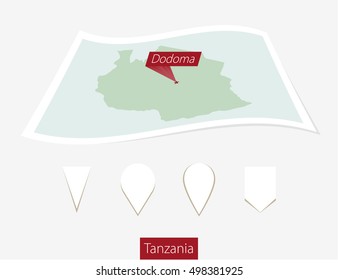 Curved paper map of Tanzania with capital Dodoma on Gray Background. Four different Map pin set. Vector Illustration.