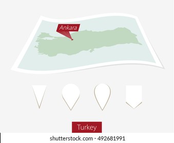 Curved paper map of Turkey with capital Ankara on Gray Background. Four different Map pin set. Vector Illustration.