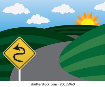 Curvy road and hills with warning sign
