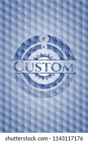 Custom blue emblem or badge with abstract geometric pattern background.