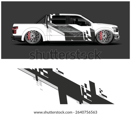 Custom designed white pickup truck with black and grey geometric racing stripes and red brake calipers.
