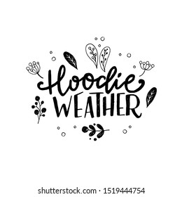 Custom handwriting Hoodie Weather with sketched elements. Hand lettering phrase meaning cold season. Seasonal handwritten saying with drawn leaves and twigs. Black and white unique script. Vector