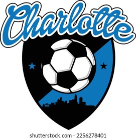 Custom illustrated soccer ball or football logo with the skyline buildings silhouette of the City Charlotte North Carolina inside a shield crest and script text up above. Vector eps graphic design.