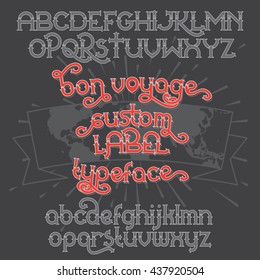 Custom retro typeface Bon Voyage. Vintage alphabet font set on the dark background and world map ribbon scroll