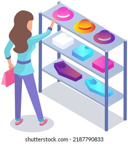 Customer choosing garments in womens clothing store. Female buyer buys hat, shirt and trousers during shopping. Purchaser service mall. Girl shopper stands near shelf with clothes in shop or boutique