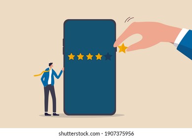 Customer experience or customer review by giving rating 5 stars, feedback from people who use service or application concept, businessman standing with mobile phone with giant hand rating five stars.