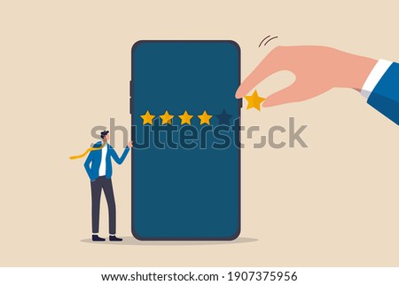Customer experience or customer review by giving rating 5 stars, feedback from people who use service or application concept, businessman standing with mobile phone with giant hand rating five stars.