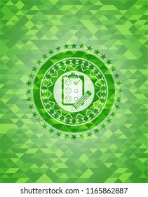 customer feedback icon inside realistic green mosaic emblem