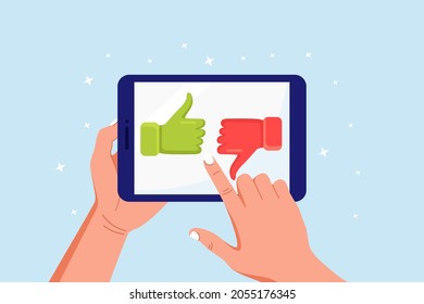 Customer feedback, rating and review concept. Human hands holding tablet with like and dislike. Thumb up and down on computer pc screen. Blogging, online messaging, social network services