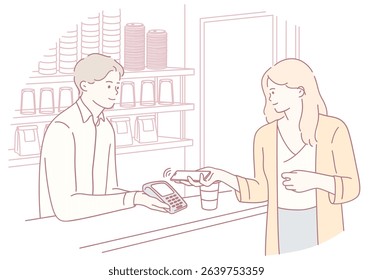 A customer making a payment with a card at a caf, showcasing modern payment methods