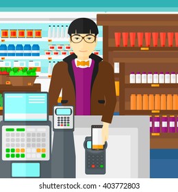 Customer paying with his smartphone using terminal.