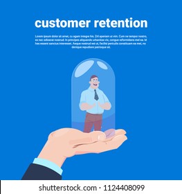 Customer retention manager hand holding a client in cover a glass bulb over blue background flat vector illustration