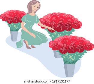 Customer sits near a big bunch of red flowers. Young woman in a flower shop chooses best roses