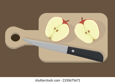 cut apple on a wooden board with a knife