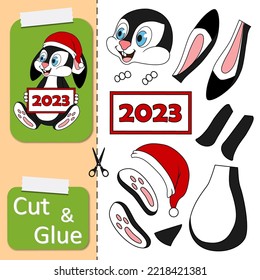 Cut and glue the paper game with rabbit in santa hat holding card with text 2023 in his paws. Create application cartoon Rabbit as symbol of 2023 New Year. Kids logic game and activities jigsaw.