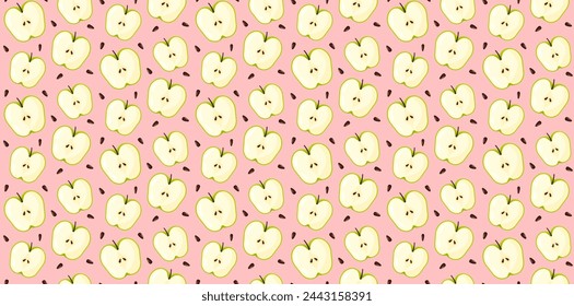 Cut green apple with seeds pattern on pink background. Fruit ornament