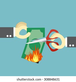 Cut loss,business man cut his money with scissors for protect from fire burning
