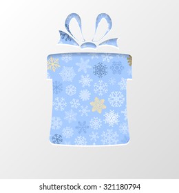 Cut out the paper in shape gift box for Christmas, with white snowflakes on light blue background