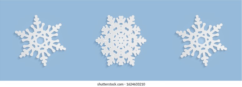 Cut out snowflake patterns with soft shadows. White and blue winter backgrounds of New Year or Christmas decorations for design, greeting cards, banners,  printing and other. Vector illustrations set.