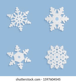 Cut out snowflakes silhouettes with soft shadows. White and blue xmas vector illustrations collection. Winter holidays, New year and Christmas decorations. Trendy modern paper elements for your design