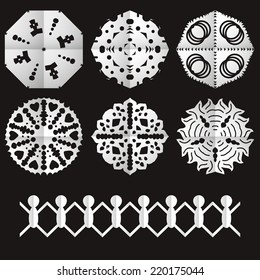 Cut from paper old style snowflakes