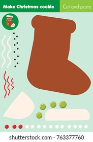 Cut and paste children educational game. Paper cutting activity. Make a New Year, Christmas sock with glue. DIY worksheet.