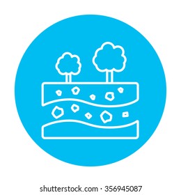 Cut of soil with different layers and trees on top line icon for web, mobile and infographics. Vector white icon on the light blue circle isolated on white background.