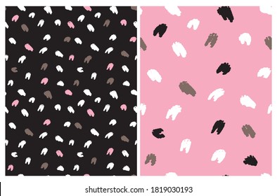 Cute Abstract Geometric Seamless Vector Pattern. White, Pink, Brown and Black Irregular Brush Spots Isolated on a Black and Pink Backgrounds. Funny Doodle Print. Abstract Wild Animal Skin.
