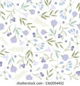 Cute abstract seamless pattern with small colorful  flowers on the white background.Summer floral vector illustration.Template for prints,book covers, textile,fabric,wrapping gift paper.