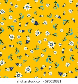Cute abstract seamless pattern with small colorful chamomile flowers on the yellow background.Summer floral vector illustration.Template for prints,book covers, textile,fabric,wrapping gift paper.