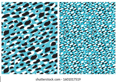 Cute Abstract Spots Seamless Vector Pattern. White and Black Irregular Brush Dots on a Light Blue Background. Abstract Wild Animal Skin Vector Print ideal for Fabric, Textile, Wrapping Paper, Cover.