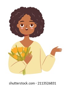 Cute African girl with a flower bouquet pointing at something. Tulips in hands. March 8 character isolated on white background.