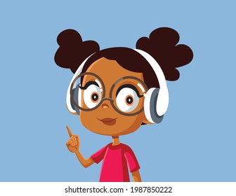 Cute African Girl Wearing Headphones Listening to Music. Sweet kid wearing wireless headset pointing her finger
