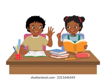 Cute African school kids studying doing homework together at the desk