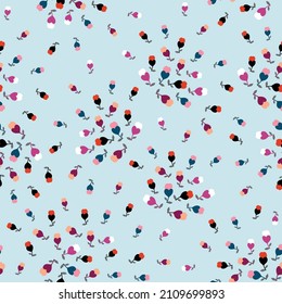 cute all over seamless floral vector small multi color flowers pattern on blue background
