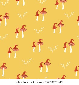Cute amanita vector seamless pattern. Funny autumn print with hand drawn poisonous toadstool mushrooms on yellow background