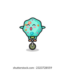 El lindo personaje ameba está montando una bicicleta de circo, diseño de estilo lindo para camisetas, pegatinas, elemento logo