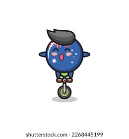 The cute australia flag badge character is riding a circus bike , cute style design for t shirt, sticker, logo element