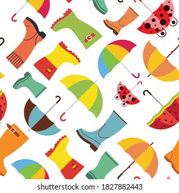 Cute autumn pattern with rubber boots and umbrellas. Fall season seamless background